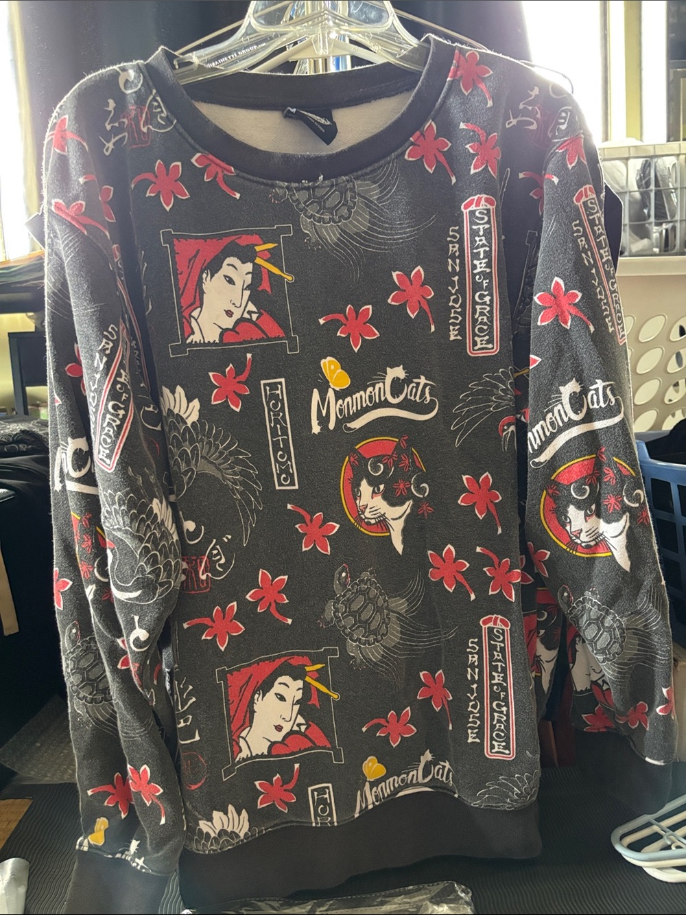 Small Black Graphic Sweatshirt with Red Tattoo Design Accents